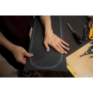 Hands holding grip tape